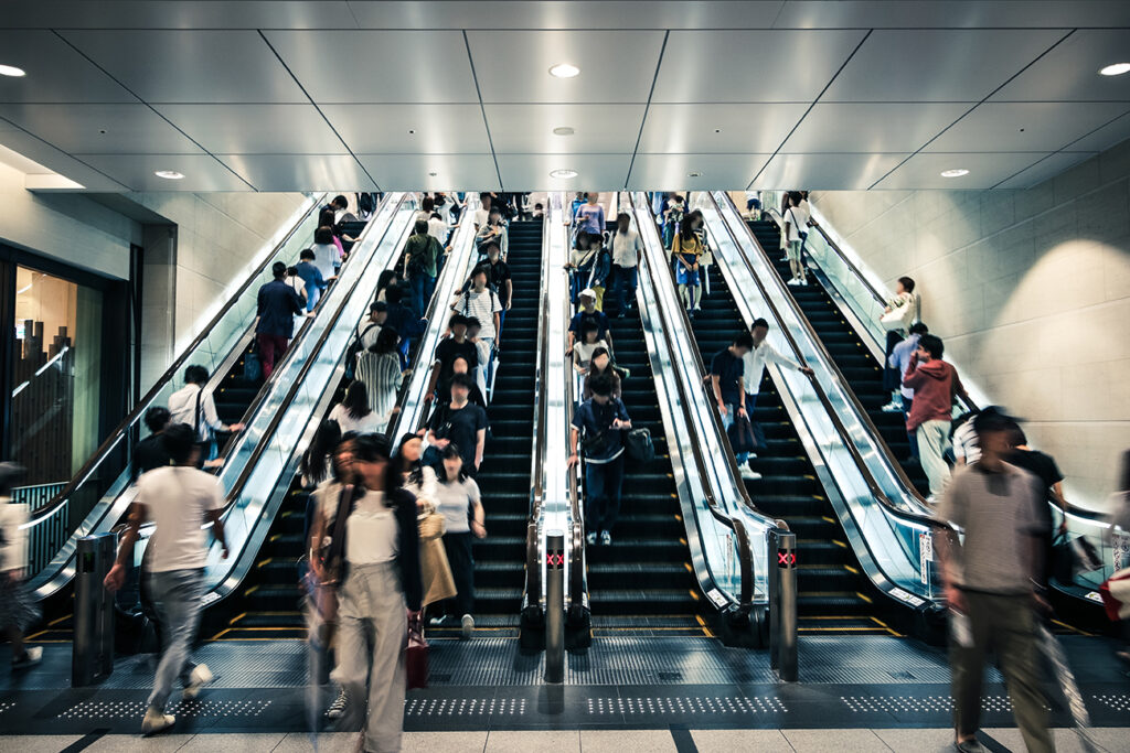 People riding escalators